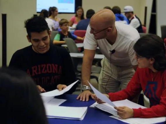 Instructor interacting with two student