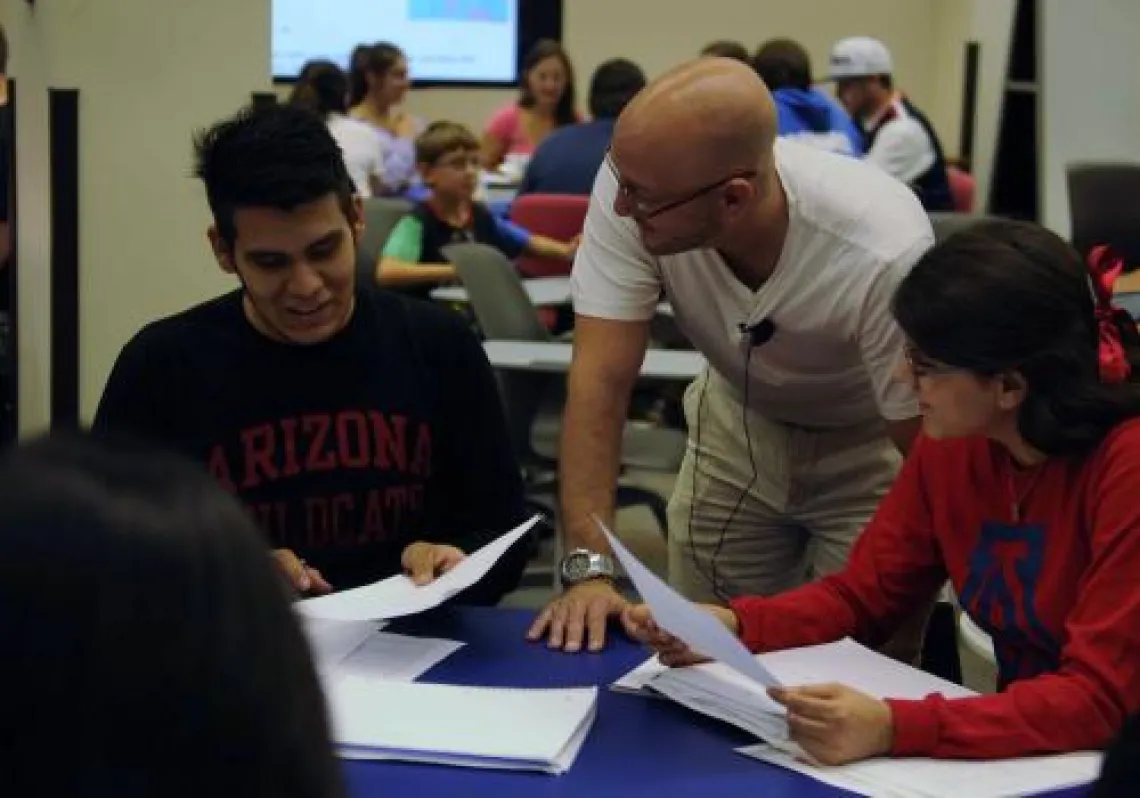 Instructor interacting with two student